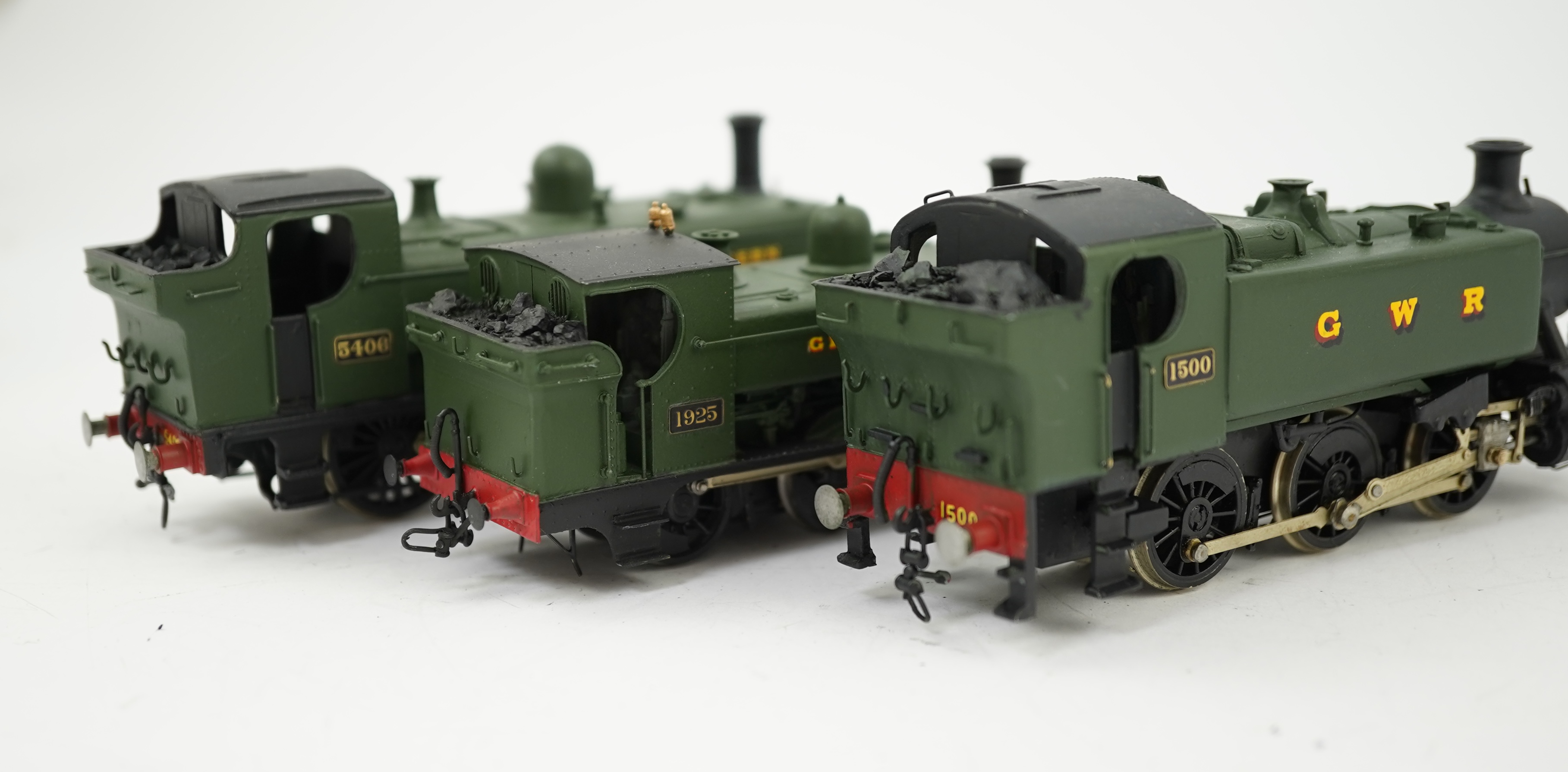 Three 00 gauge brass and white metal kit built GWR tank locomotives; a 15xx class 0-6-0T, 1500, together with an 54xx class 0-6-0PT, 5406, and a 19xx class 0-6-0PT, 1925, all constructed, painted and lined to a high stan